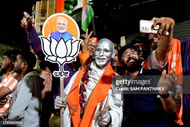 Supporters of Bharatiya Janata party cheer during a felicitation program organised for Gujarat State Chief Minister Bhupendrabhai Patel in Ahmedabad...