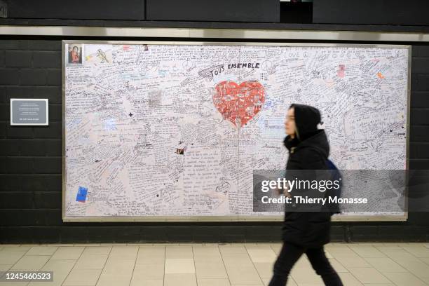 Commuters pass beside a panel with remembrance messages in Maelbeek metro station on December 8, 2022 in Brussels, Belgium. Mohamed Abrini, Osama...