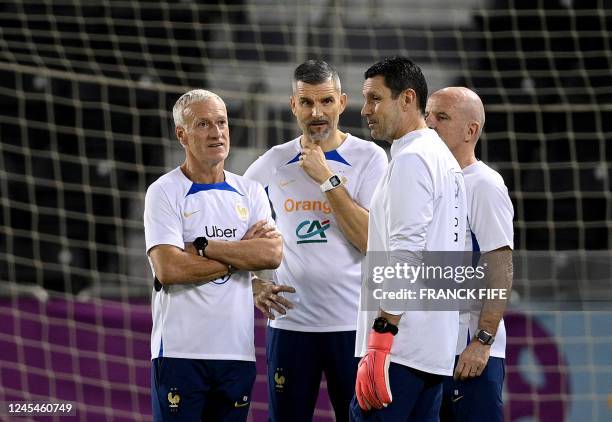 France's coach Didier Deschamps, France's physical trainer Cyril Moine, France's goalkeeper coach Franck Raviot and France's head coach Guy Stephan...