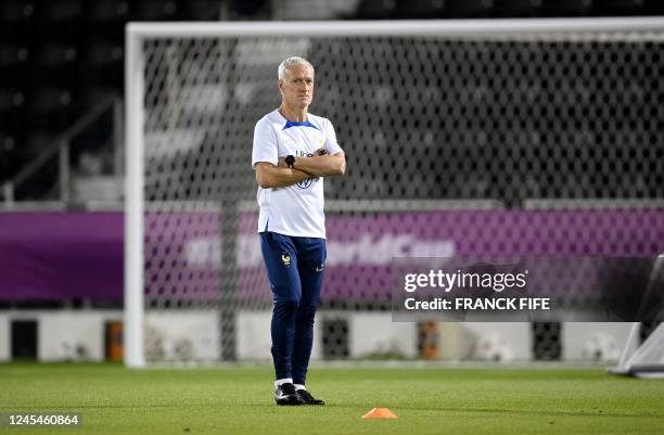 France's coach Didier Deschamps attends a training session at the Al Sadd SC training center in Doha, on December 8 in the build-up to the Qatar 2022...