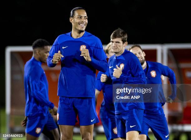 Virgil van Dijk of Holland, Marten de Roon of Holland and Daley Blind of Holland during a training session of the Dutch national team at the Qatar...