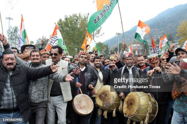 Congress supporters celebrating victory after winning in Himachal Pradesh state elections, on December 8, 2022 in Kullu, India. The Congress emerged...