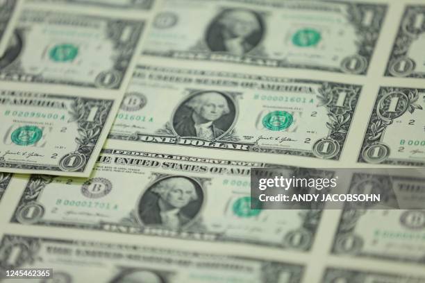 One dollar notes with the signature of US Treasury Secretary Janet Yellen are unveiled at the Bureau of Engraving and Printing Western Currency...