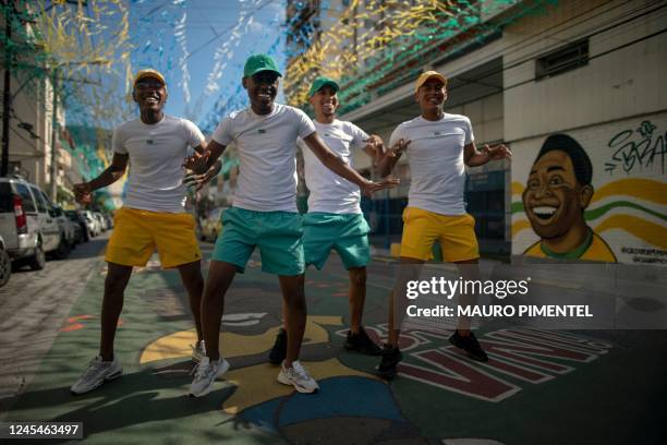 Funk music group Os Quebradeiras dance on a street decorated for the Qatar 2022 World Cup at Tijuca neighborhood, in Rio de Janeiro, Brazil, on...