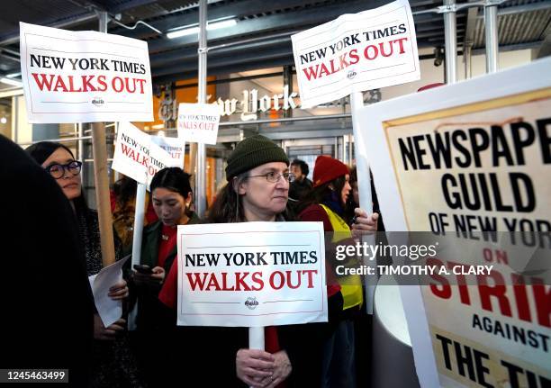 Newsroom staff and employees of The New York Times walk out of the office for a 24-hour strike, in New York City on December 8, 2022. - More than...