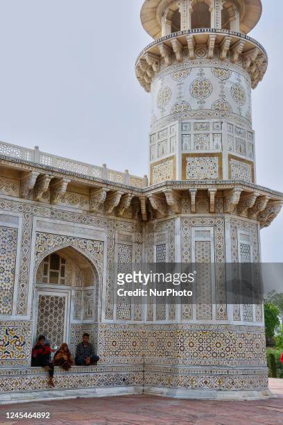 People sit in a niche of the mausoleum of Itmad-ud-Daulah's tomb in Agra, Uttar Pradesh, India, on May 04, 2022. The Tomb of Itimad-ud-Daulah was...