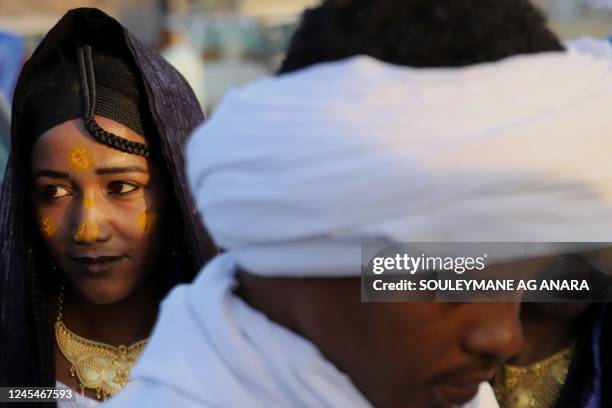 Young Tuareg woman looks on in Iferouane on December 4, 2022 during the Festival de l'Aïr, a celebration of the culture of the semi-nomadic Tuareg...