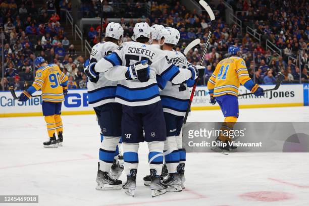Members of the Winnipeg Jets celebrate after scoring a goal against the St. Louis Blues in the second period at Enterprise Center on December 8, 2022...