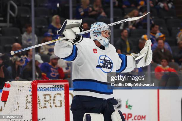 Connor Hellebuyck of the Winnipeg Jets celebrates after beating the St. Louis Blues at Enterprise Center on December 8, 2022 in St Louis, Missouri.