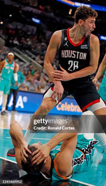 Alperen Sengun of the Houston Rockets reacts after being called for a charge on Zach Collins of the San Antonio Spurs in the second half at AT&T...