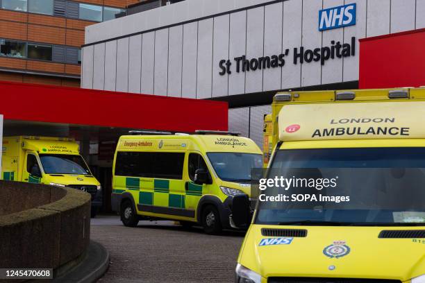 Ambulances belonging to the London Ambulance Service are parked at St. Thomas' Hospital. More than 10,000 NHS ambulance staff from nine NHS hospital...