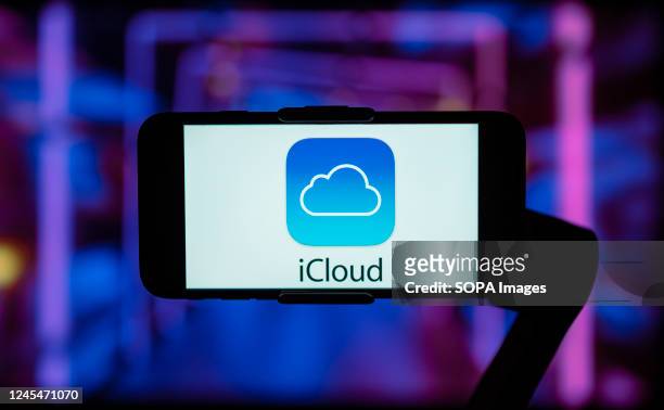 In this photo illustration, the logo of iCloud is seen displayed on a mobile phone screen.