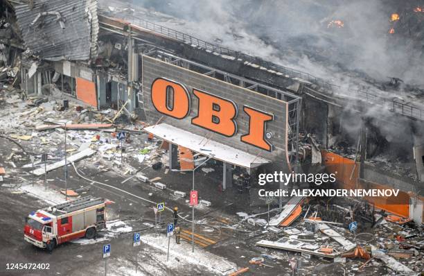 Russia firefighters battle a massive blaze the size of a football pitch which broke out overnight at the Mega Khimki shopping and entertainment...