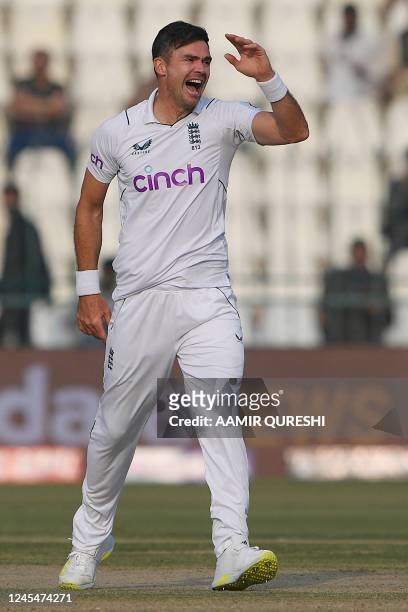 England's James Anderson celebrates after taking the wicket of Pakistan's Imam-ul-Haq during the first day of the second cricket Test match between...