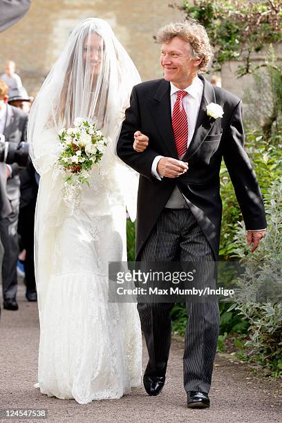 Mary-Clare Winwood and Steve Winwood arrive at the church of St. Peter and St. Paul, Northleach for Mary-Clare's wedding to Ben Elliot on September...