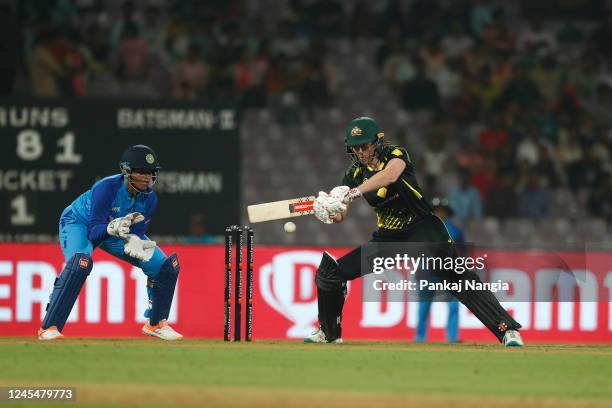 Tahlia McGrath of Australia plays a shot during the T20 International series between India and Australia at Dr DY Patil Cricket Stadium on December...