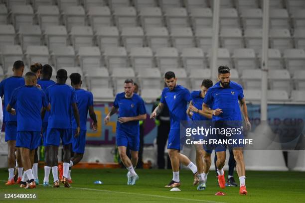 France players including France's forward Olivier Giroud take part in a training session at Al Sadd SC Stadium in Doha, on December 9 on the eve of...