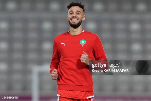 Morocco's defender Noussair Mazraoui smiles during a training session at the Al Duhail SC Stadium in Doha on December 9 on the eve of the Qatar 2022...