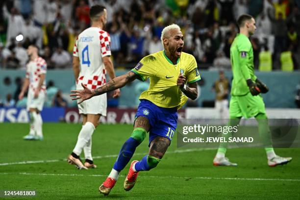 Brazil's forward Neymar celebrates scoring his team's first goal during the Qatar 2022 World Cup quarter-final football match between Croatia and...