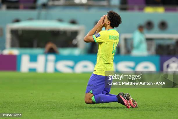 Marquinhos of Brazil reacts after missing his penalty and Brazil being eliminated during the FIFA World Cup Qatar 2022 quarter final match between...