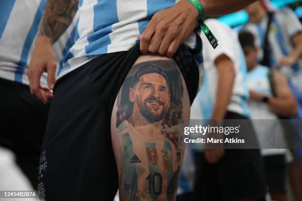 Argentina fan showing off a tattoo of Argentina's Lionel Messi ahead of their FIFA World Cup Qatar 2022 quarter final match between Netherlands and...