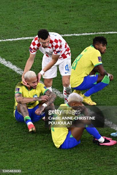 Croatia's midfielder Ivan Perisic gestures to Brazil's forward Neymar at the end of the Qatar 2022 World Cup quarter-final football match between...