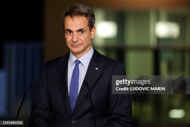 Greece's Prime Minister Kyriakos Mitsotakis takes part in a joint press conference during the EU-MED9 Euro-Mediterranean Group Summit on December 9,...