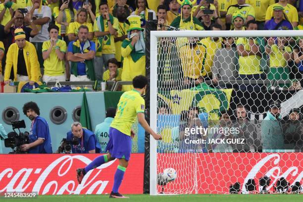 Brazil's defender Marquinhos fails to score the last shot in the penalty shoot-out during the Qatar 2022 World Cup quarter-final football match...