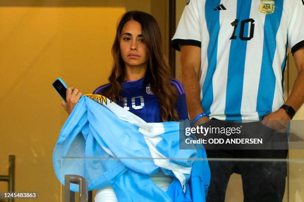 Antonela Roccuzzo, the wife of Lionel Messi, takes her seat ahead of the Qatar 2022 World Cup quarter-final football match between The Netherlands...