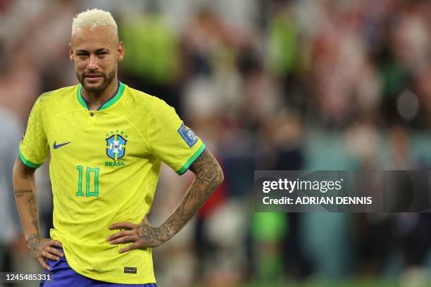 Brazil's forward Neymar reacts after his team lost the Qatar 2022 World Cup quarter-final football match between Croatia and Brazil at Education City...