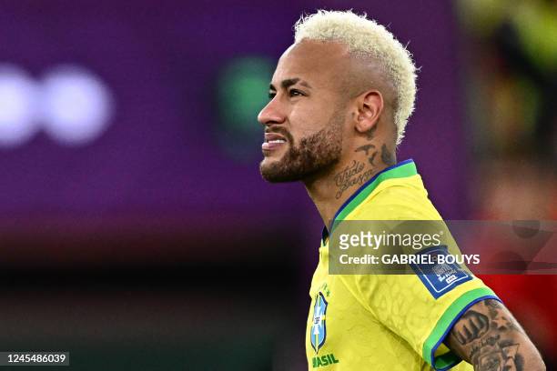 Brazil's forward Neymar gestures during the penalty shoot-out after extra-time of the Qatar 2022 World Cup quarter-final football match between...