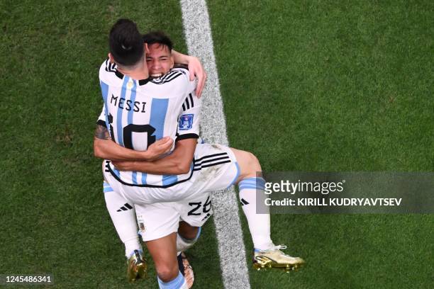Argentina's defender Nahuel Molina celebrates scoring his team's first goal with Argentina's forward Lionel Messi during the Qatar 2022 World Cup...
