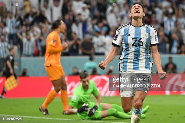 Argentina's defender Nahuel Molina celebrates scoring his team's first goal during the Qatar 2022 World Cup quarter-final football match between...