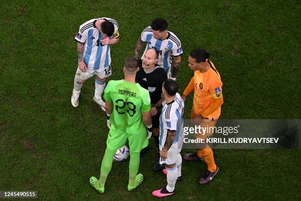Netherlands players argue with Spanish referee Antonio Mateu after he called for a penalty during the Qatar 2022 World Cup quarter-final football...