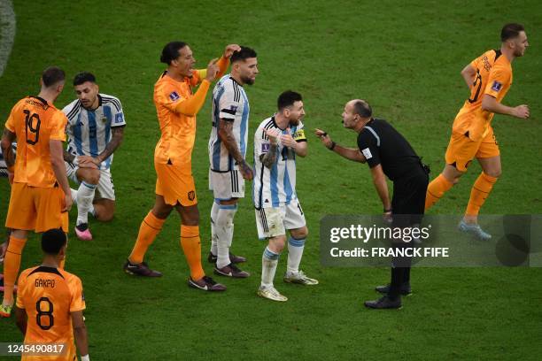 Argentina's forward Lionel Messi argues with Spanish referee Antonio Mateu during the Qatar 2022 World Cup quarter-final football match between The...