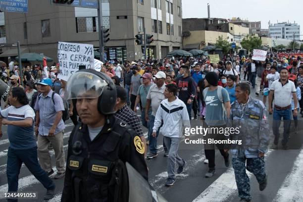 Supporters of Pedro Castillo, Peru's former president, protest his impeachment and arrest on Avenida Abancay in Lima, Peru, on Friday, Dec. 9, 2022....