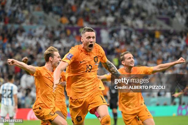 Netherlands' forward Wout Weghorst celebrates scoring his team's second goal during the Qatar 2022 World Cup quarter-final football match between...