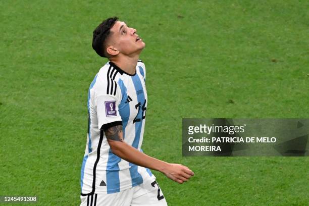Argentina's defender Nahuel Molina celebrates scoring his team's first goal during the Qatar 2022 World Cup quarter-final football match between The...