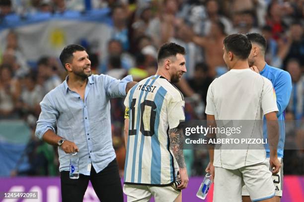 Argentina's forward Lionel Messi, Argentina's midfielder Leandro Paredes , Argentina's forward Paulo Dybala celebrate with ex-player Sergio Aguero...