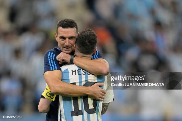 Argentina's forward Lionel Messi is embraced by Argentina's coach Lionel Scaloni after their team's victory in the Qatar 2022 World Cup quarter-final...