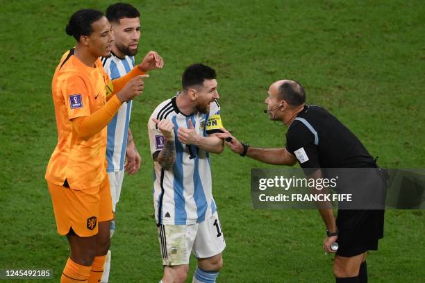 Argentina's forward Lionel Messi argues with Spanish referee Antonio Mateu during the Qatar 2022 World Cup quarter-final football match between The...