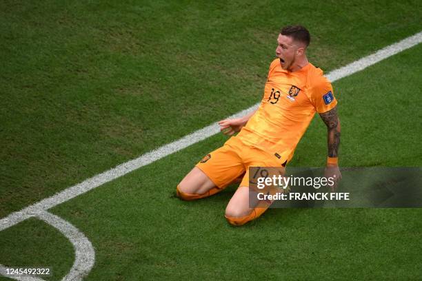 Netherlands' forward Wout Weghorst celebrates after he scored his team's second goal during the Qatar 2022 World Cup quarter-final football match...