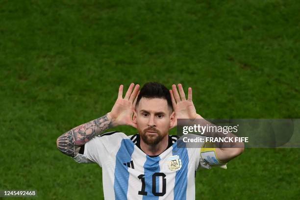 Argentina's forward Lionel Messi celebrates after he scores his team's second goal from the penalty spot during the Qatar 2022 World Cup...