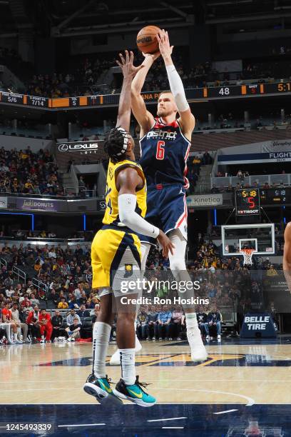 Kristaps Porzingis of the Washington Wizards shoots the ball during the game against the Indiana Pacers on December 9, 2022 at Gainbridge Fieldhouse...