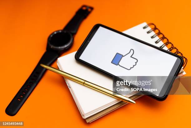 In this photo illustration a Facebook Like Button logo seen displayed on a smartphone.