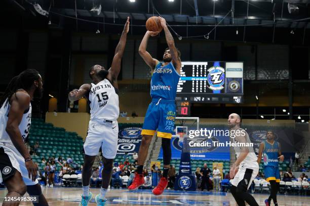 Tyler Dorsey of the Texas Legends shoots the ball against Chaundee Brown of the Austin Spurs in the second quarter on December 09, 2022 at Comerica...