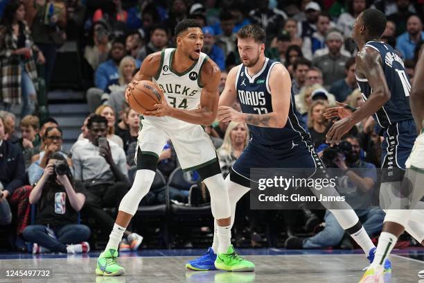Giannis Antetokounmpo of the Milwaukee Bucks handles the ball during the game against the Dallas Mavericks on December 9, 2022 at the American...