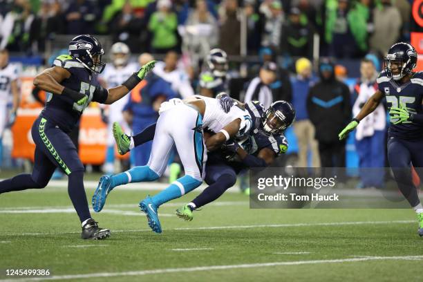 Carolina Panthers wide receiver Devin Funchess is tackled by Seattle Seahawks free safety Steven Terrell during an NFL game between the Seattle...