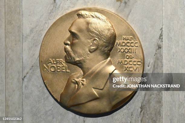 Plaque showing Swedish chemist, engineer, inventor, businessman, and philanthropist Alfred Nobel is seen on the podium during preparations ahead of...