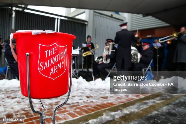 Salvation Army band plays in the snow outside the Stadium before the Sky Bet Championship match at Ewood Park, Blackburn. Picture date: Saturday...